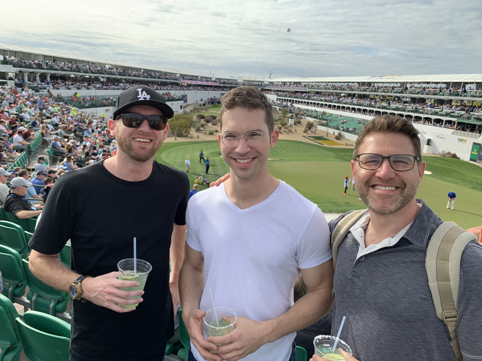 Team photo at the famous #16 stadium hole with client and lead developer