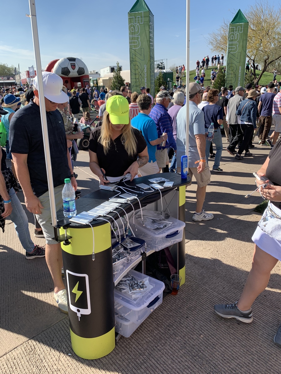 Juuice charging kiosk in operation with attendees